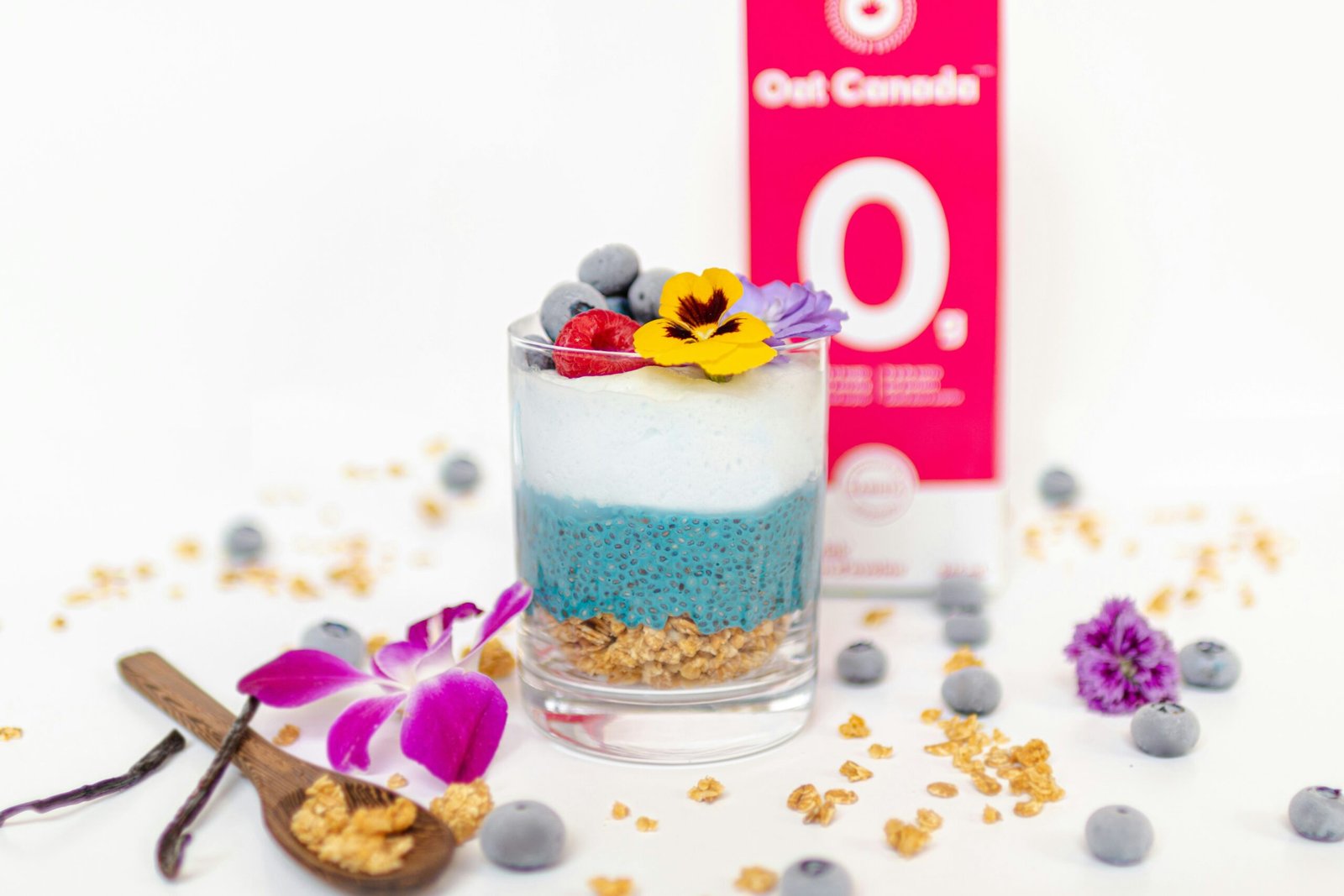 ice cream with purple flower on clear glass cup